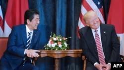 U.S. President Donald Trump (right) takes part in a bilateral meeting with Japanese Prime Minister Shinzo Abe on the sidelines of the G7 summit in Taormina, Sicily, on May 26.
