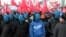 Far-right protesters march with faces covered during their annual march, which coincides with Poland's national Independence Day in Warsaw.