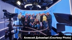Belsat staffers are shown in a photo from earlier this year. The station reported that Belarusian security forces raided their Minsk studio on May 21.