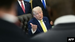 US President Donald Trump speaks to reporters in the Oval Office of the White House on June 4.