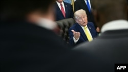 US President Donald Trump speaks to reporters in the Oval Office of the White House on June 4.