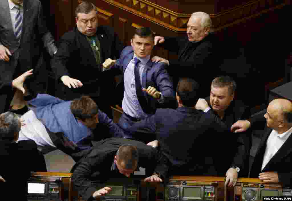 A right hook from the far-right as&nbsp;Mykhaylo Holovko from the Svoboda party clashes with members of the Communist Party in April 2014.&nbsp;