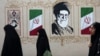 Women walk by a mural depicting Iran's late Supreme Leader Ayatollah Ali Khamenei in Tehran earlier this week. 
