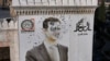 A bullet-riddled portrait of ousted Syrian President Bashar al-Assad hangs over Hama's municipality building after it was defaced following the capture of the city by anti government fighters earlier this month. 