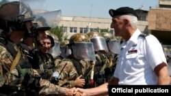 Armenia - The commander of the U.S. Army in Europe, Lieutenant General Mark Hertling, inspects Armenian peacekeeping troops in Yerevan, 18Jul2012.