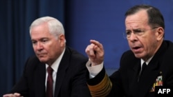 U.S. Defense Secretary Robert Gates and Chairman of the Joint Chiefs of Staff, Admiral Mike Mullen, acknowledged Washington is considering possible military action in the Libyan crisis.