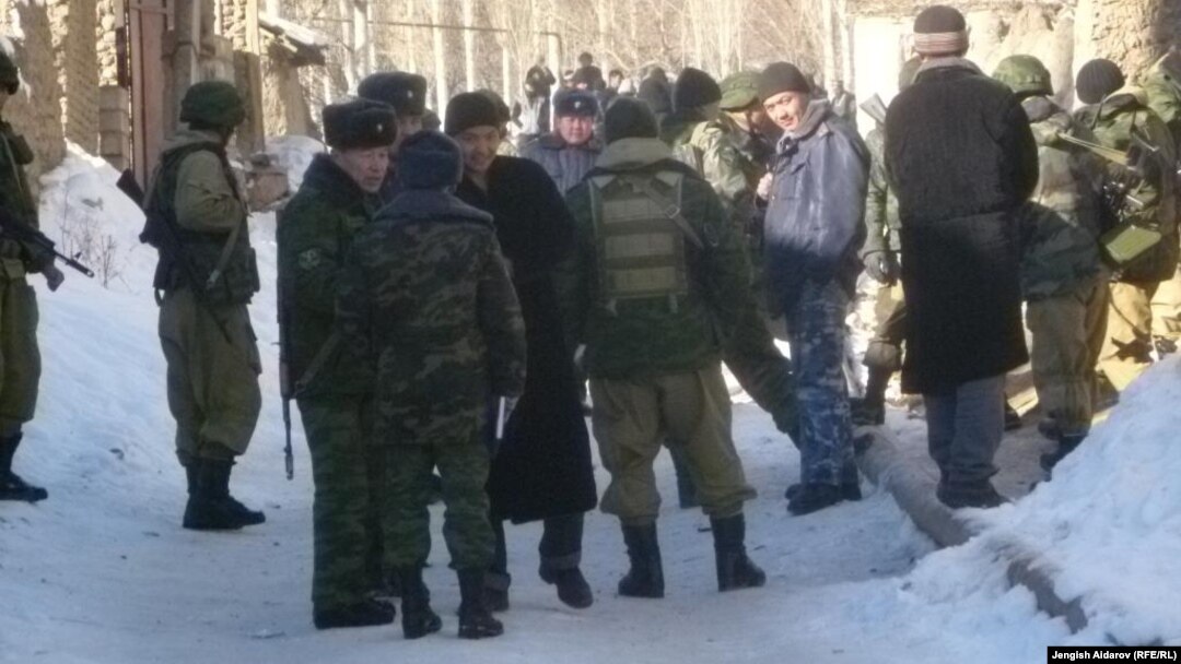 Residents and police gather in Uzbekistan's Sokh exclave on January 6.
