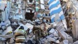 Russia -- Russian Emergency Situations Ministry employees clearing the debris at the site of an apartment building collapse