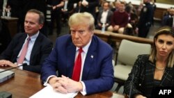 (FILES) Former US President Donald Trump sits in New York State Supreme Court during the civil fraud trial against the Trump Organization, in New York City on January 11, 2024.