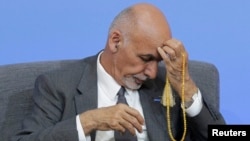 Afghan President Ghani, seen here at an international anticorruption summit in London in May 2016, has recently overseen hundreds of dismissals of government employees for graft.