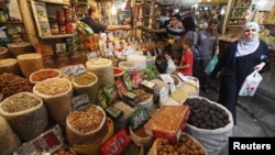 Iraqis shop at a market in Baghdad in preparation for Ramadan.