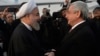 Armenia - President Serzh Sarkisian (R) greets his Iranian counterpart Hassan Rouhani at Yerevan airport, 21Dec2016.