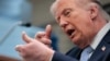 US President Donald Trump mimics firing a gun as he speaks about the conflict in Iran at the White House on April 6. 