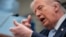 US President Donald Trump mimics firing a gun as he speaks about the conflict in Iran at the White House on April 6. 