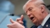 US President Donald Trump mimics firing a gun as he speaks about the conflict in Iran at the White House on April 6. 