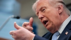 US President Donald Trump mimics firing a gun as he speaks about the conflict in Iran in the James S. Brady Press Briefing Room of the White House on April 6, 2026, in Washington, DC. (Photo by Kent Nishimura / AFP)