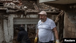 Spasioci u potrazi za žrtvama poplava i odrona u Donjoj Jablanici, BiH, 5. 10. 2024.