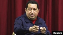 Venezuela -- President Hugo Chavez chats during a television broadcast in Caracas, 11Apr2012