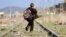 A Turkish boy walks along railroad tracks disused since the closure of the Turkish-Armenian border. The new agreement foresees the border reopening.