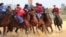 Kazakhstan (blue) prevailed as usual in kokpar, its version of goat-grabbing, by a score of 5-4 over Kyrgyzstan in the final at the World Nomad Games. 