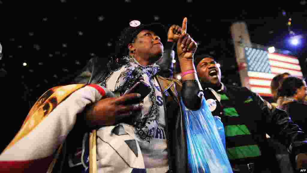 Obama supporter Dina Rutledge watches voting results on election night in Chicago, Illinois.