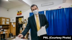 Ludovic Orban, the Romanian prime minister and leader of the National Liberal Party (PNL), casts his vote in parliamentary elections on December 6. 