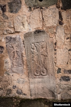 Khachkars embedded in the walls of Dadivank Monastery.