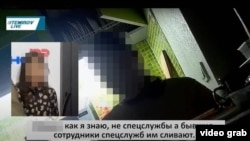 Разговор Айгуль с оперативниками был записан. Скриншот видеозаписи позже опубликовал анонимный аккаунт в Facebook. Фото: автор неизвестен