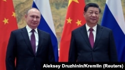 Russian President Vladimir Putin meets with Chinese President Xi Jinping in Beijing on February 4. The Ukraine crisis is a test for Beijing and Moscow’s warming ties -- one that analysts believe China and Russia will pass.

