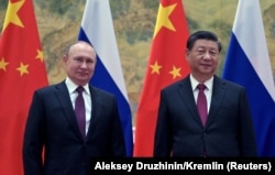 Russian President Vladimir Putin attends a meeting with Chinese President Xi Jinping in Beijing on February 4.