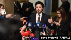 Deputy Prime Minister Dritan Abazovic, whose party voted with the opposition to bring down the government, speaks to reporters on February 4.