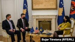 U.S. special envoy Gabriel Escobar (left) and EU envoy Miroslav Lajcak meet with the president of Kosovo, Vjosa Osmani, in Pristina on January 31.