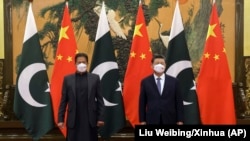 Pakistani Prime Minister Imran Khan and Chinese President Xi Jinping pose for a photo before their bilateral meeting at the Great Hall of the People on February 6. 