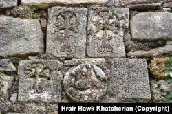 Details, including Armenian script, on a wall of the fifth-century Yeghishe Arakyal Monastery in the Tartar region of Azerbaijan.