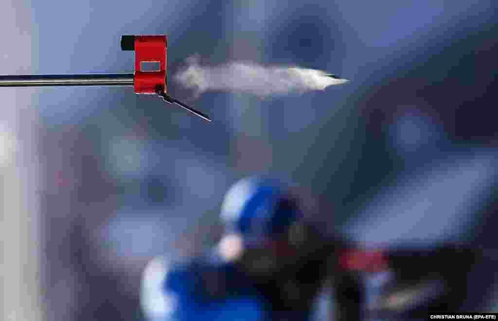 Dzmitry Lazouski of Belarus in action at the shooting range during a men&#39;s 20-kilometer biathlon race at the Winter Olympics in Beijing.&nbsp;