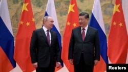 Presidenti rus, Vladimir Putin dhe ai i Kinës, Xi Jinping. 