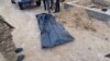 GRAB Kazakh Police Exhuming Bodies Of January Protest Victims Against Families' Wishes