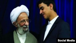 Mehrshad Soheili crafted an image of being close to influential clerics in Iran. The 17-year-old has now been arrested on accusations of fraud. He is shown here with senior Ayatollah Mesbah Yazdi, the godfather of Iran's hard-liners, who died in 2020.