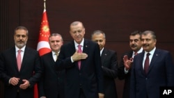 Turkey - Turkish President Recep Tayyip Erdogan stands with the new cabinet members during the inauguration ceremony at the presidential complex in Ankara, June 3, 2023. 