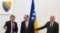 BOSNIA-HERYEGOVINA -- German diplomat Christian Schmidt (L) shakes hands with Chairman of Bosnia and Herzegovina's tripartite Presidency, Zeljko Komsic (C) and Presidency member Sefik Dzaferovic, before a meeting in Sarajevo, August 3, 2021