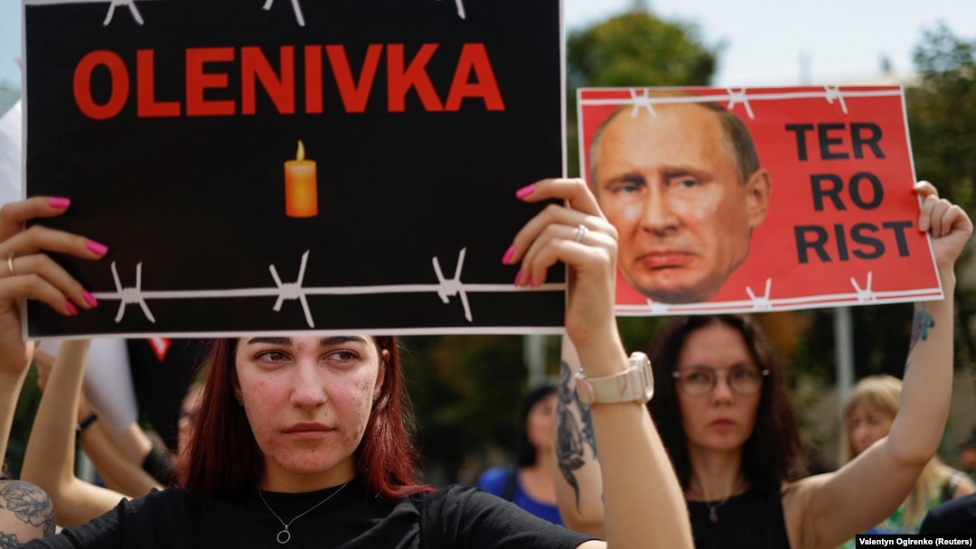 Relatives of defenders of the Azovstal steelworks in Mariupol hold a rally in Kyiv on July 30 demanding that Russia be designated as a terrorist state following the deaths of Ukrainian POWs in a deadly attack on a prison in Olenivka. 