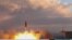 A TV grab taken on September 23 from state broadcaster IRIB shows a Khorramshahr missile being launched from an undisclosed location, a day after the missile was first displayed at a high-profile military parade.