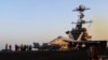 Image taken from video provided by the US Navy shows an aircraft launching from the USS Harry S. Truman in the Red Sea before air strikes in Sanaa, Yemen, on March 15.