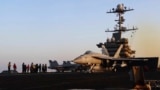 Image taken from video provided by the US Navy shows an aircraft launching from the USS Harry S. Truman in the Red Sea before air strikes in Sanaa, Yemen, on March 15.