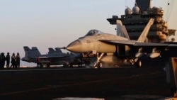 Image taken from video provided by the US Navy shows an aircraft launching from the USS Harry S. Truman in the Red Sea before air strikes in Sanaa, Yemen, on March 15.