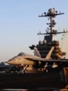 Image taken from video provided by the US Navy shows an aircraft launching from the USS Harry S. Truman in the Red Sea before air strikes in Sanaa, Yemen, on March 15.