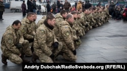 PHOTO GALLERY: In Ukraine, Soldiers' Funerals, Food Distribution Amid New Outburst Of Fighting (click to enlarge)