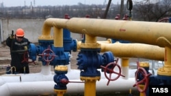A worker checks the gas-distribution system "Donetsk 1" in Donetsk, in eastern Ukraine, on March 3.