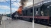 This handout photograph taken and released by the press service of Ukrainian Railways on October 4, 2025, shows a burning train carriage following a drone attack in Shostka, Sumy region, amid the Russian invasion of Ukraine.