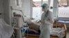 Ukraine -- Doctors provide care to patients with COVID-19, Ovruch, Zhytomyr region, 16 March 2021